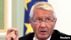 FILE - Thorbjorn Jagland, secretary general of the Council of Europe, talks to reporters in Kyiv, Ukraine, Sept. 10, 2012.