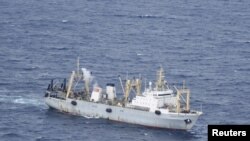 Russian emergencies ministry vessel conducts rescue operation after trawler Dalniy Vostok sank off the coast of Kamchatka, April 2, 2015.