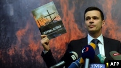 FILE - Russia's opposition activist Ilya Yashin attends the presentation of an independent expert report entitled "Putin. War" in Moscow, May 12, 2015. 