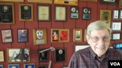 Floyd Creekmore, 95, the face behind 'Creeky the Clown,' with his many clowning awards and recognitions. (J.Kent/VOA)