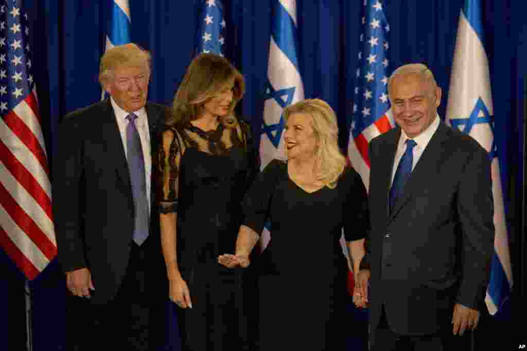 U.S. President Donald Trump and his wife Melania, and Israeli Prime Minister Benjamin Netanyahu and his wife Sara stand after their meeting in Jerusalem, Monday, May 22, 2017.