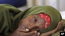 A malnourished woman lies in a field hospital of the International Rescue Committee, IRC, in the town of Dadaab, Kenya, (File).