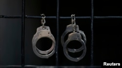 Handcuffs hang in a Hamas-run prison where alleged collaborators with Israel are held in Gaza City April 23, 2013. The Islamist Hamas government, which is pledged to Israel's destruction by force of arms, is lauding a recent campaign to root out informant