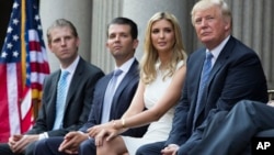 FILE - From left, Eric Trump, Donald Trump Jr. and Ivanka Trump — shown with their father at a groundbreaking ceremony for the Trump International Hotel in Washington, July 23, 2014 — are among those scheduled to speak at the 2016 Republican National Conv