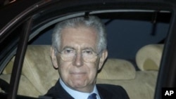 Former European commissioner and top designated Italian Premier Mario Monti leaves the Senate, in Rome, November 13, 2011.