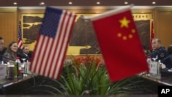 U.S. and Chinese officials during a bilateral meeting at the Bayi Building in Beijing, China, December 7, 2011.