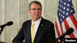 U.S. Secretary of Defense Ash Carter listens to French Minister of Defense Jean-Yves Le Drianin, Nov. 28, 2016, in Washington. Carter makes his last trip to Asia next week to meet with U.S. allies.
