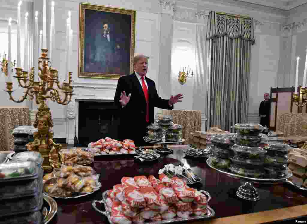 President Donald Trump speaks in front of the tables of fast food for the the college football playoff champion Clemson Tigers in the State Dining Room of the White House in Washington, Jan. 14, 2019. (Credit: Brad Mills-USA TODAY Sports)