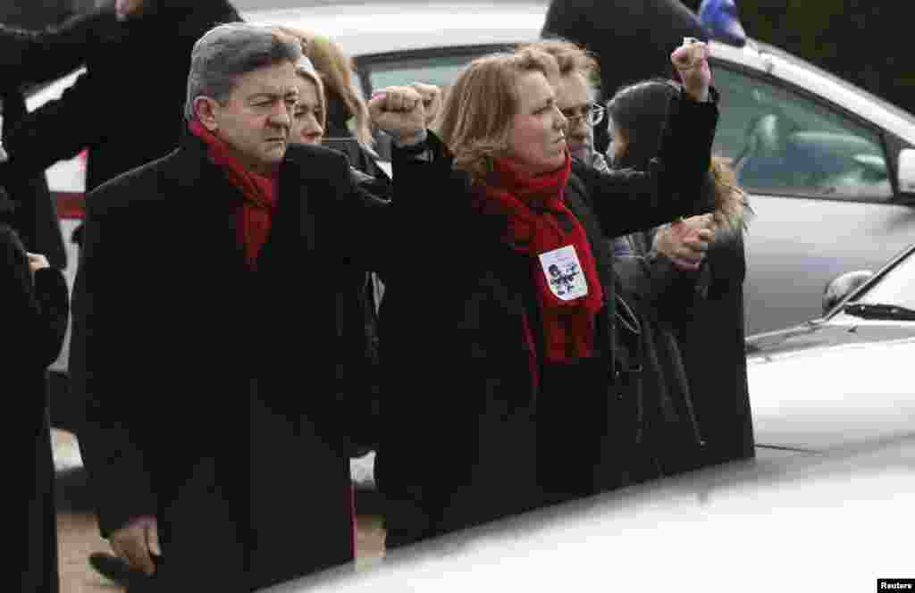 Jean-Luc Melenchon, left, the leader of the French far-left Parti de Gauche, at a tribute to late satirical French magazine Charlie Hebdo cartoonist and editor-in-chief Stephane Charbonnier, known as Charb, in Pontoise, near Paris, Jan. 16, 2015. 