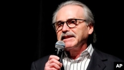 FILE - David Pecker, chairman and CEO of American Media, addresses those attending a Super Bowl party in New York, Jan. 31, 2014.