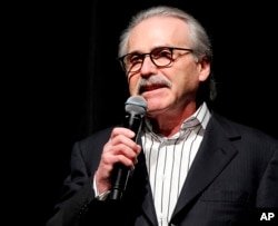 FILE - In this Jan. 31, 2014, photo, David Pecker, chairman and CEO of American Media, addresses those attending a Super Bowl party in New York.