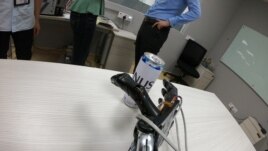 A robotic hand with the AiFoam reaches for a can at National University Singapore's Materials Sciences and Engineering lab in Singapore June 30, 2021.