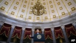 President Joe Biden delivers remarks on the one year anniversary of the January 6 attack on the U.S. Capitol, during a ceremony in Statuary Hall, Thursday, Jan. 6, 2022 at the Capitol in Washington. (Drew Angerer/Pool via AP)