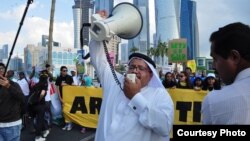 Người biểu tình tuần hành trên đường phố của Doha trong lúc hội nghị khí hậu đang tiếp diễn. (Richard Casson, Oxfam)
