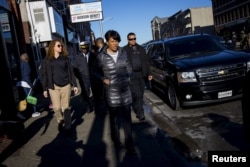 FILE - Baltimore Mayor Stephanie Rawlings-Blake tours Pennsylvania Avenue as Maryland State Police stand guard, April 28, 2015.