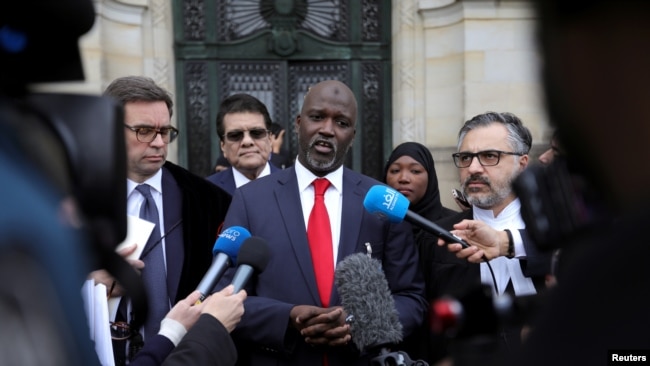 Gambia's Justice Minister Abubacarr Tambadou talks to the media outside the International Court of Justice (ICJ), after the ruling in a case filed by Gambia against Myanmar alleging genocide against the minority Muslim Rohingya population, in The Hague.