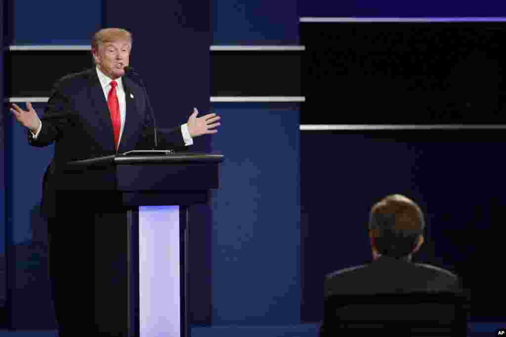 Republican presidential nominee Donald Trump answers a question during the third presidential debate at UNLV in Las Vegas, Wednesday, Oct. 19, 2016. (AP Photo/John Locher)