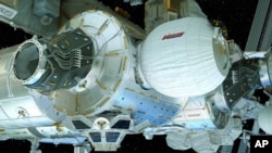 FILE - This illustration provided by Bigelow Aerospace on April 6, 2016, shows the Bigelow Expandable Activity Module (BEAM), center right, attached to the International Space Station.
