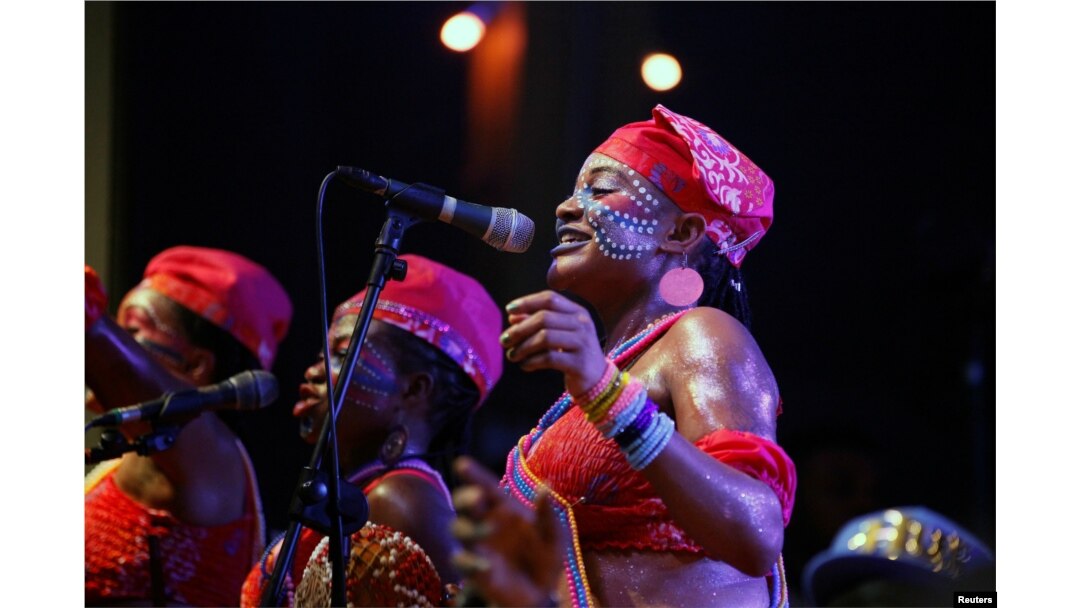 FILE - Backup singers are seen on stage as Afrobeat musician Femi Kuti performs at the annual musical celebration in honor of Nigeria's music icon Fela Kuti at the New Afrika Shrine in Lagos, Nigeria, early Oct. 17, 2016.
