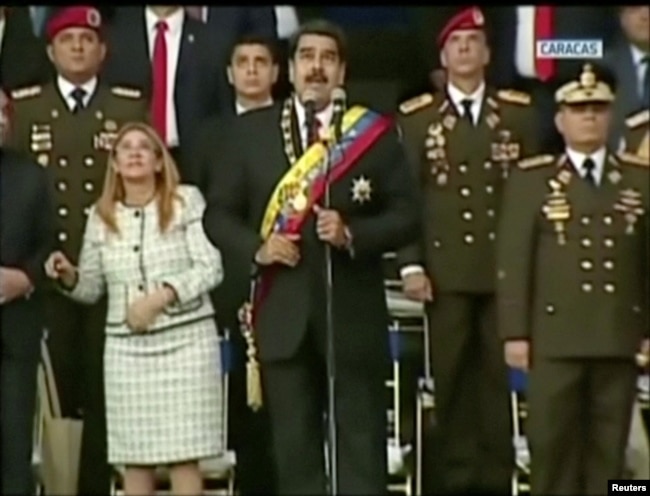 Venezuelan President Nicolas Maduro reacts during an event that was interrupted, reportedly by explosives from drones, in this still frame taken from government video, Aug. 4, 2018, in Caracas, Venezuela.