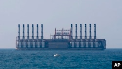 A floating power station waits off the coast at Jiyeh, south of Beirut, Lebanon, July 16, 2018.