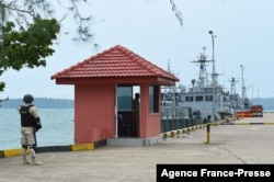 FILE - Cambodian navy personnel guard a jetty in Ream Naval Base in Preah Sihanouk province during a government organized media tour, July 26, 2019.