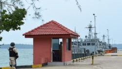 Cambodian navy personnel guard a jetty in Ream naval base in Preah Sihanouk province during a government organized media tour on July 26, 2019.