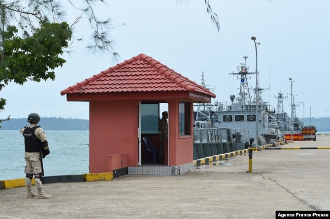 FILE - Cambodian navy personnel guard a jetty in Ream Naval Base in Preah Sihanouk province during a government organized media tour, July 26, 2019.