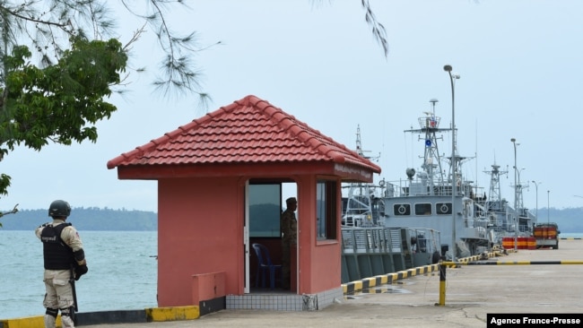Cambodian navy personnel guard a jetty in Ream naval base in Preah Sihanouk province during a government organized media tour on July 26, 2019.