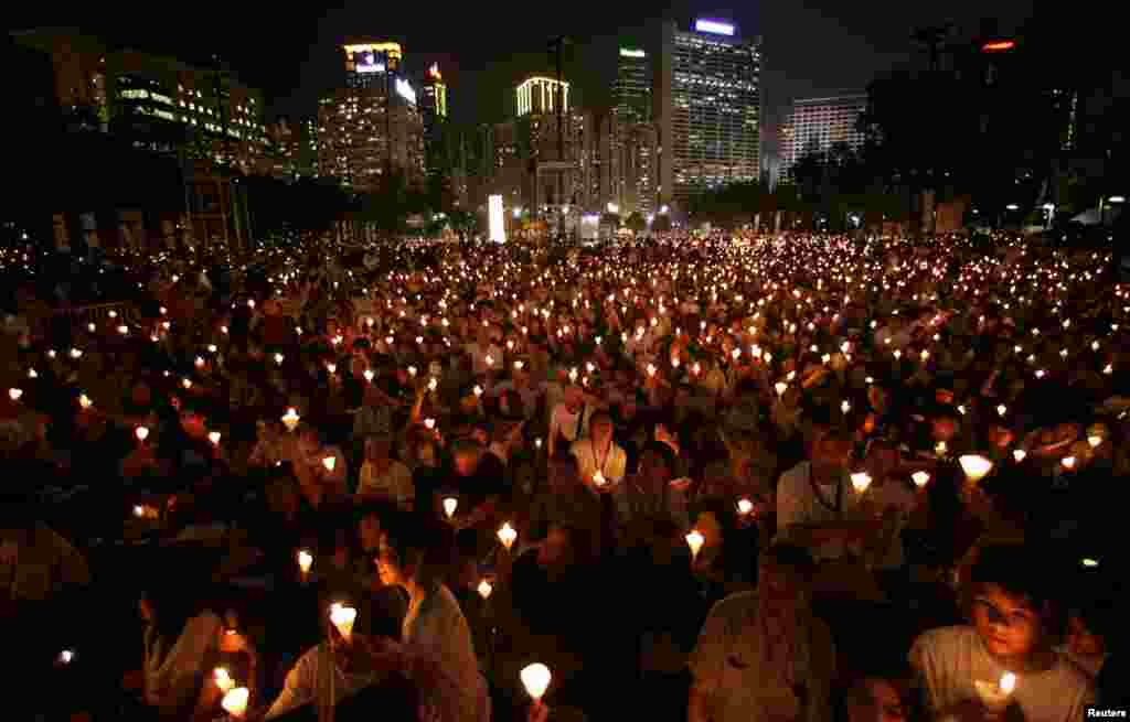 Activists hold a candlelight vigil at Hong Kong's Victoria Park, June 4, 2009, to mark the 20th anniversary of the crackdown on the pro-democracy movement in Beijing's Tiananmen Square in 1989. 