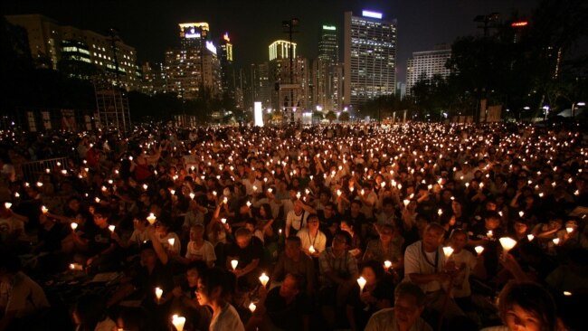 FILE - Candles flicker in Hong Kong's Victoria Park during a June 4, 2009, vigil to remember the crackdown on the pro-democracy movement in Beijing's Tiananmen Square.