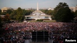People pack the West Lawn of the U.S. Capitol to see Pope Francis appear on the Speaker's balcony during his speech to the U.S. Congress in Washington, Sept. 24 2015.