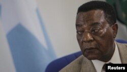 Augustine Mahiga, Special Representative of the United Nations Secretary-General for Somalia and head of the U.N. Political Office in Somalia (UNPOS), looks on during a news conference in Mogadishu August 19, 2012.