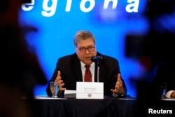 FILE - U.S. Attorney General William Barr speaks at a news conference in San Salvador, El Salvador, May 16, 2019.