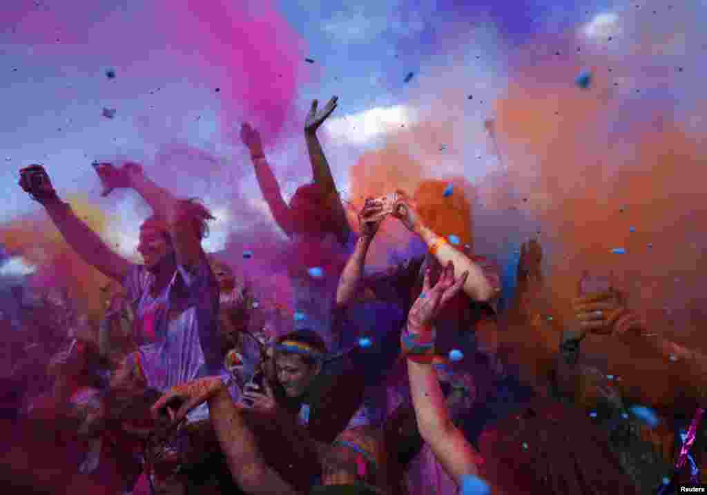 Multi-colored dyes are thrown in the air by participants during Sydney&#39;s Color Run, Australia.