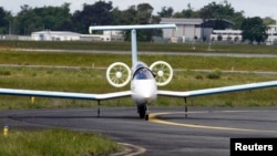 An E-Fan aircraft is seen on the tarmac for its first public flight during the e-Aircraft Day at the Bordeaux Merignac airport, southwestern France. The all-electric plane E-Fan, developed by Airbus Group, April 25, 2014. 