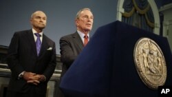 New York City Mayor Michael Bloomberg, right, speaks to reporters after a ruling on "stop and frisk."