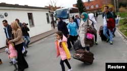 Syrian refugees arrive at the camp for refugees and migrants in Friedland, Germany, April 4, 2016.