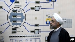 FILE - In this Jan. 13, 2015, file photo released by the Iranian President's Office, President Hassan Rouhani visits the Bushehr nuclear power plant just outside of Bushehr, Iran. 