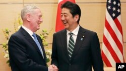U.S. Defense Secretary Jim Mattis and Japanese Prime Minister Shinzo Abe shake hands at the prime minister's office in Tokyo, Feb. 3, 2017. Mattis' visit helped reaffirm Japan's status as the cornerstone U.S. ally in the Pacific.