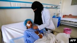A Yemeni girl injured during a reported airstrike in the Kisar district of the northern Hajjah province receives treatment at a hospital in the Houthi rebel-held capital Sanaa, March 11, 2019.