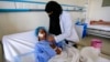 A Yemeni girl injured during a reported airstrike in the Kisar district of the northern Hajjah province receives treatment at a hospital in the Houthi rebel-held capital Sanaa, March 11, 2019.