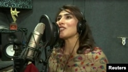 Sana Tajik, 20, performs in a music recording studio in this screen grab taken from an undated video. 