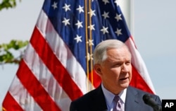 FILE - Attorney General Jeff Sessions speaks at a news conference after touring the U.S.-Mexico border with border officials, April 11, 2017, in Nogales, Ariz.