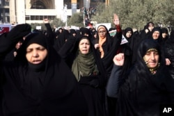Iranian women chant slogans at a rally in Tehran, Iran, Dec. 30, 2017.