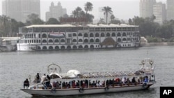 Egyptians enjoy a ride along the Nile river, February 15, 2011
