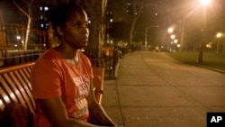 FILE - In this June 23, 2015 photo, refusing to return to a shelter following a confrontation with another resident, Candie Hailey sits on a bench near the housing complex where she once lived, pondering where she will spend the night, in New York.