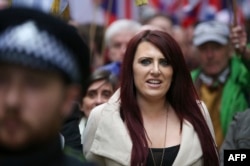 FILE - Jayda Fransen, acting leader of the far-right organization Britain First, marches in central London, April 1, 2017.
