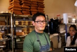 Chef Bun Lai of Miya's Sushi poses at his restaurant in New Haven, Connecticut, Aug. 28, 2018.