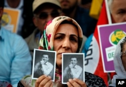 Supporters of the pro-Kurdish Peoples' Democratic Party (HDP) some holding pictures of the party's former co-leader Selahattin Demirtas, currently in prison on charges of leading a terror organisation, chant slogans during a rally announcing him as a presidential candidate in Istanbul, May 4, 2018.